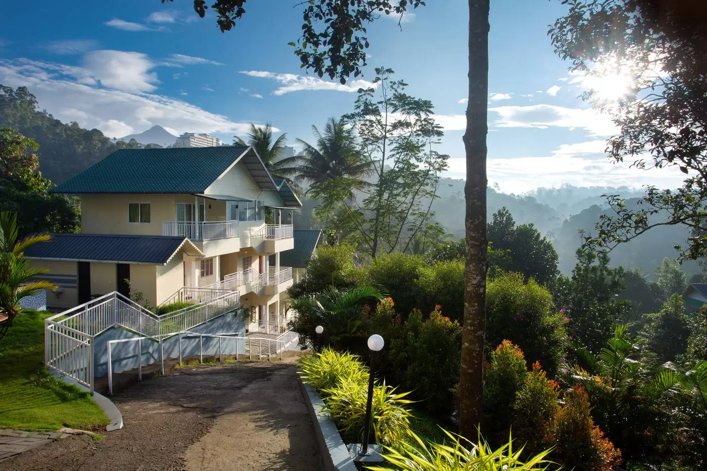 https://homesloc.com/uploads/Rainwood-Arbour-Resort-Munnar-exterior-10-1727342168.webp